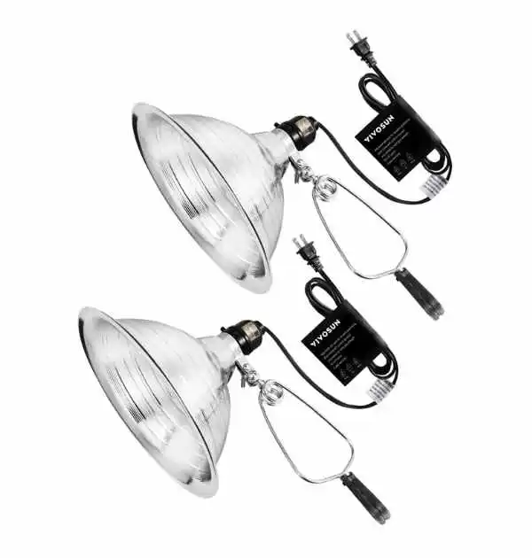 Two silver metal halide lamps with a cord, designed for heating in a dog house environment.